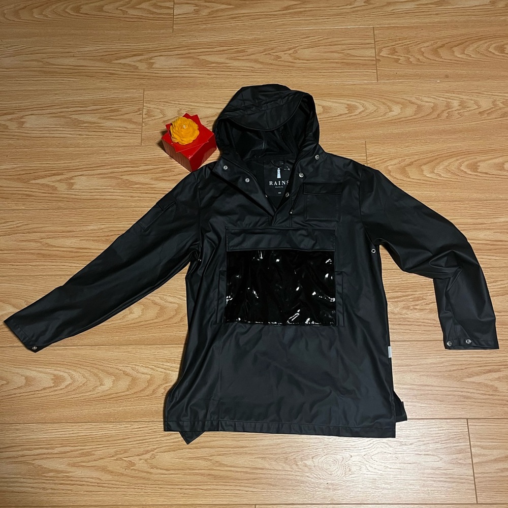 Black pull over Rains rain jacket